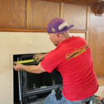professional installing a gas fireplace insert